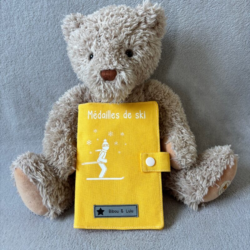 Livret médailles de ski - Garçon ou fille - Jaune